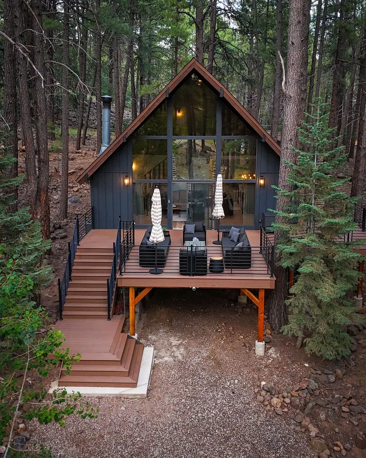 Composite deck and stairs on an A-frame in the pines