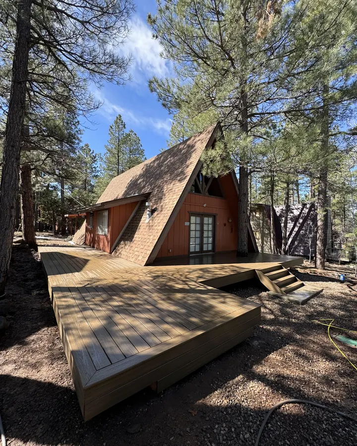 Wraparound composite deck on an A-frame cabin
