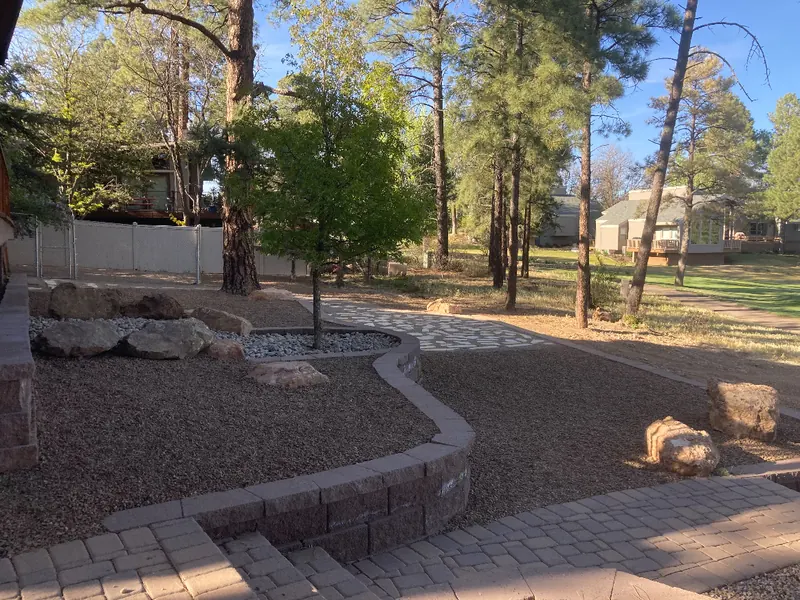 Paver path, raised bed and boulders