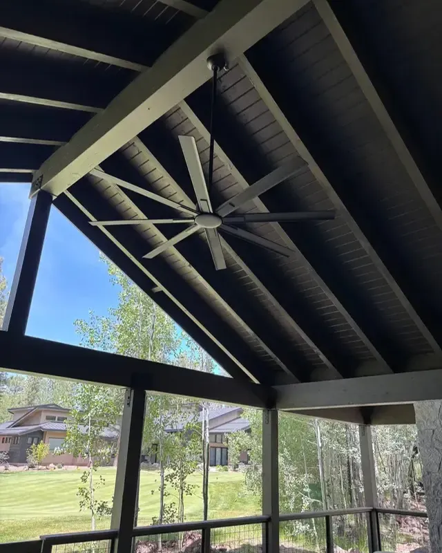 Covered porch with a vaulted ceiling and ceiling fan
